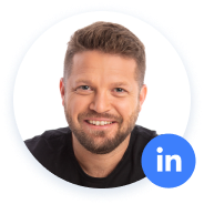 Smiling man with LinkedIn icon in profile photo.